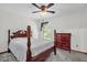 Cozy bedroom with a four-poster bed, dresser, and ample natural light at 2885 Newmark Dr, Deltona, FL 32738