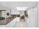 Bright kitchen with white cabinets, modern appliances, and eat-in dining area at 2885 Newmark Dr, Deltona, FL 32738