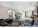 Inviting living room features a large sliding glass door, and bright natural light at 2885 Newmark Dr, Deltona, FL 32738