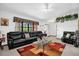 Open-concept living room with bright lighting, a large window, and a comfortable seating arrangement at 2885 Newmark Dr, Deltona, FL 32738