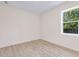 Bright bedroom features stylish floors and a window offering natural light at 2894 Hardy Ave, New Smyrna Beach, FL 32168