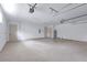 Well-lit garage features epoxy flooring for a clean and functional space at 2894 Hardy Ave, New Smyrna Beach, FL 32168