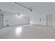 Large garage boasts epoxy flooring and plenty of room for vehicles and projects at 2894 Hardy Ave, New Smyrna Beach, FL 32168