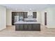 Modern kitchen features sleek countertops, stainless steel appliances, and a large island, perfect for culinary enthusiasts at 2894 Hardy Ave, New Smyrna Beach, FL 32168