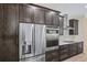 Contemporary kitchen boasting stainless steel appliances, modern cabinets, and a mosaic backsplash, for a sophisticated look at 2894 Hardy Ave, New Smyrna Beach, FL 32168