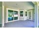 Covered patio features sliding glass doors, offering indoor-outdoor living at 2894 Hardy Ave, New Smyrna Beach, FL 32168
