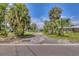 Charming street view with palm trees lining the avenue, offering a tropical residential ambiance at 2894 Hardy Ave, New Smyrna Beach, FL 32168