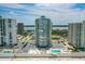 Stunning aerial view of the beachfront condo with pool and ocean views in a vibrant coastal community at 2987 S Atlantic Ave # 903, Daytona Beach, FL 32118