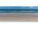 Expansive beachfront view of the ocean, sandy beach, and clear blue sky at 2987 S Atlantic Ave # 903, Daytona Beach, FL 32118