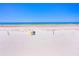 Wide, sunny beach with clear skies and scattered vegetation at 2987 S Atlantic Ave # 903, Daytona Beach, FL 32118