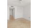 Bright bedroom featuring tile flooring and large closet with white louvered doors at 2987 S Atlantic Ave # 903, Daytona Beach, FL 32118