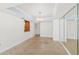 Open dining area with chandelier and view into kitchen and through windows at 2987 S Atlantic Ave # 903, Daytona Beach, FL 32118
