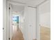 Bright hallway with tile floors, leading to ocean-view bedroom, and closet space at 2987 S Atlantic Ave # 903, Daytona Beach, FL 32118
