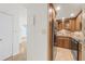 This kitchen offers stainless steel appliances, wood cabinetry, granite countertops, and tile backsplash at 2987 S Atlantic Ave # 903, Daytona Beach, FL 32118