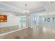Elegant living space featuring marble floors, a chandelier, and ocean views at 2987 S Atlantic Ave # 903, Daytona Beach, FL 32118