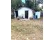Backyard of house with a shed and a wheelbarrow at 3 Cassia Ln, Debary, FL 32713