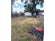 Backyard with a firepit, a table and an outdoor rug at 3 Cassia Ln, Debary, FL 32713