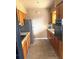 Traditional kitchen with wood cabinets and stainless steel refrigerator at 3 Cassia Ln, Debary, FL 32713