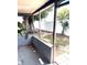 Screened patio with a table, chairs, and views of the backyard at 3 Cassia Ln, Debary, FL 32713