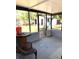 Screened patio with a table, chairs, and views of the backyard at 3 Cassia Ln, Debary, FL 32713