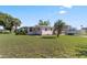 Charming single-story home with a well-maintained lawn and boat on a trailer in the driveway at 3267 S Peninsula Dr, Daytona Beach, FL 32118