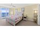 Bright bedroom featuring a seaside motif, balcony access, and serene ocean views at 3315 S Atlantic Ave # 1406, Daytona Beach Shores, FL 32118