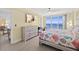 Comfortable bedroom has balcony access with an ocean view and a dresser with TV at 3315 S Atlantic Ave # 1406, Daytona Beach Shores, FL 32118