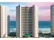 Exterior view of the condominium building showcasing ocean views and a well-maintained facade at 3315 S Atlantic Ave # 1406, Daytona Beach Shores, FL 32118