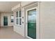 Condo entrance showing door, sidelight, and balcony at 3315 S Atlantic Ave # 1406, Daytona Beach Shores, FL 32118