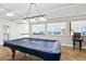 Bright game room boasts beautiful ocean views, a pool table, and a stylish light fixture at 3315 S Atlantic Ave # 1406, Daytona Beach Shores, FL 32118