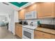 Bright kitchen with granite countertops, stainless steel appliances, and ample cabinet space at 3315 S Atlantic Ave # 1406, Daytona Beach Shores, FL 32118