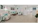 Bright living room with coastal decor, light wood floors, and comfortable white furniture at 3315 S Atlantic Ave # 1406, Daytona Beach Shores, FL 32118