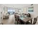 Open-concept living and dining area with ocean views and sliding glass doors to a balcony at 3315 S Atlantic Ave # 1406, Daytona Beach Shores, FL 32118