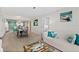 Open-concept living room showcasing the dining and kitchen area at 3315 S Atlantic Ave # 1406, Daytona Beach Shores, FL 32118