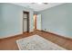 Light-filled bedroom with closet and wood floors at 352 Harlan Ave, Lake Helen, FL 32744
