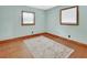 Bedroom with hardwood floors, and bright, sunlit windows at 352 Harlan Ave, Lake Helen, FL 32744