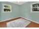 Charming bedroom with two bright windows and beautiful hardwood floors at 352 Harlan Ave, Lake Helen, FL 32744