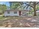 A lovely single-story home featuring a covered carport and a cozy front entrance at 352 Harlan Ave, Lake Helen, FL 32744