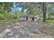 Charming home exterior with mature tree and lovely yard at 352 Harlan Ave, Lake Helen, FL 32744