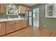 Functional kitchen with modern stainless steel refrigerator and laminate countertops at 352 Harlan Ave, Lake Helen, FL 32744