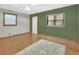 Spacious living room featuring hardwood floors, fresh paint, and a bright, airy atmosphere at 352 Harlan Ave, Lake Helen, FL 32744