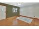 Spacious living room featuring hardwood floors, fresh paint, and a bright, airy atmosphere at 352 Harlan Ave, Lake Helen, FL 32744