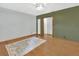 Spacious living room featuring hardwood floors, fresh paint, and a bright, airy atmosphere at 352 Harlan Ave, Lake Helen, FL 32744