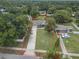 Aerial view of the home with a long driveway and well-maintained lawn, marked with a red property line at 37 Naranja Rd, Debary, FL 32713