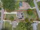 Aerial view of property showing the home, lot, and surrounding neighborhood, marked with a red property line at 37 Naranja Rd, Debary, FL 32713