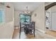 Cozy dining area with tile floors, a round table, and a window overlooking the yard at 37 Naranja Rd, Debary, FL 32713
