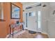 Bright foyer featuring tile flooring, modern console table, decorative mirror, and natural light at 37 Naranja Rd, Debary, FL 32713