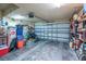 Spacious two-car garage with ample storage space, a modern garage door, and sealed concrete flooring at 37 Naranja Rd, Debary, FL 32713