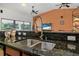 Close up of spacious kitchen featuring granite countertops, stainless steel sink, and plenty of counter space at 37 Naranja Rd, Debary, FL 32713