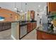 Open kitchen with granite countertops, stainless steel appliances, and seamless access to living areas at 37 Naranja Rd, Debary, FL 32713